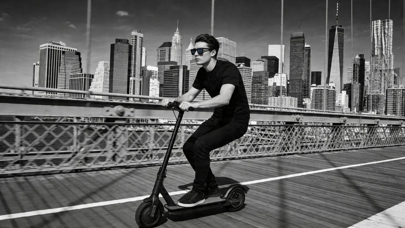 An urban e-bike rider wearing HINDSIGHT rear-view mirror eyewear — the traffic behind held in the lens.